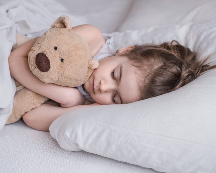 cute-little-girl-sleeps-sweetly-white-cozy-bed-with-soft-bear-toy-concept-children-s-rest-sleep